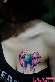 Foto mara mma nke Obi Bow Twist Tattoo