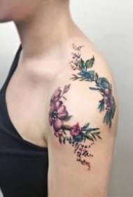girl's sexy little tattoo on the shoulder