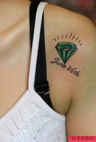 a woman shoulder diamond letter tattoo pattern