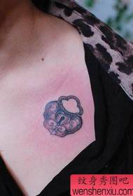 girl's chest love lock tattoo pattern