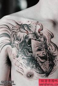chest creative mask tattoo works by tattoos