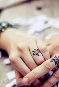 Hand in a lifetime couple finger ring tattoo