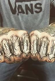 Artesano text tattoo couple fingers