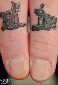 Tattoo machine tattoo on finger
