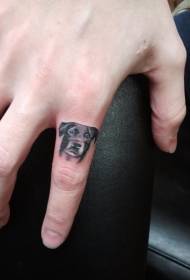手指可愛的小狗頭像紋身圖案