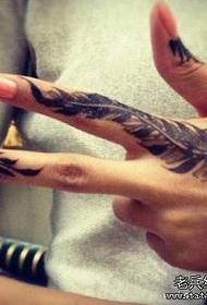 Finger feather tattoo maitiro