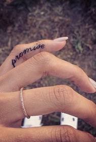 Small English tattoo on the finger