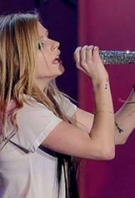 Avril Lavender Tattoos Stars on the arm notes and English tattoo pictures