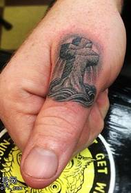 Patró de tatuatge creuat al dit