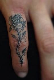 Doigt de queue noir gris rose tatouage