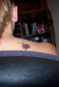 Female shoulder color ladybug tattoo pattern