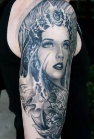 épaule femme noir-gris avec divers accessoires de tatouage