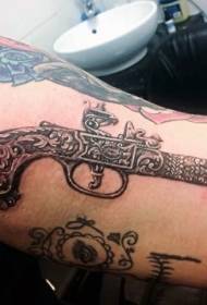 Gambar tato pistol quirky kanthi realistis