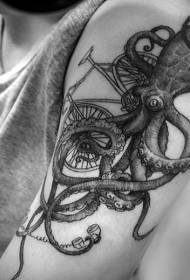 Arm musta harmaa mustekala polkupyörällä tatuointikuviolla