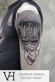 Karfafaragás stílusú fekete majomfej koponya tetoválás mintával
