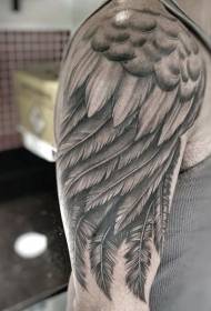 Labai subtili juodų ir baltų sparnų tatuiruotė ant pečių