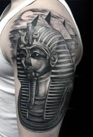 Մեծ ձեռքով եգիպտական փարավոնի արձան և բուրգի սև դաջվածքի օրինակ