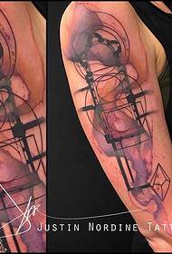 Motivo tatuaggio geometrico inchiostro spalla