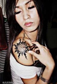 Sun totem tattoo pattern on the shoulder