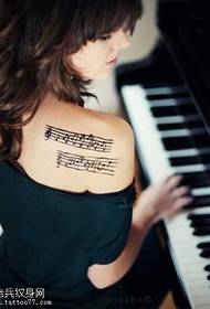 Shoulder note pattern tattoo