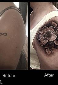 Cvjetni uzorak tetovaže koji pokriva staru tetovažu na ramenu