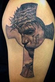 Krús en treurich portret fan Jezus tatoet