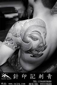 Schouder Boeddha hoofd lotus tattoo
