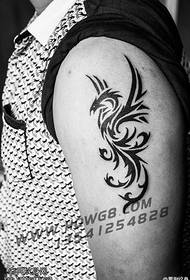 Black pricked phoenix tattoo pattern