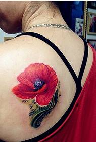 美しい女性の背中に美しく美しいポピーのタトゥーパターンの写真