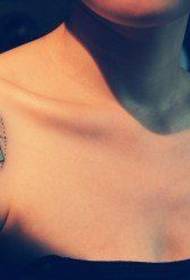 Small and popular floral tattoo pattern on the shoulder of a beautiful woman