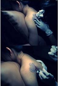 Totem heart shoulder tattoo scene