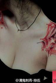 Beautiful and beautiful spider web tattoo on the shoulder of a beautiful woman