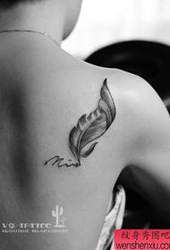 Shoulder feather tattoo