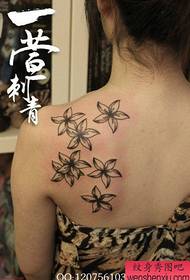 Beautiful black and white floral tattoo pattern on the shoulders of girls
