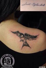 Woman shoulder swallow tattoo work