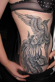 tatuaggio fenice grigio nero in vita