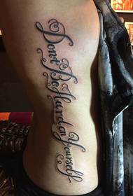 good-looking floral English tattoo pattern on the female waist