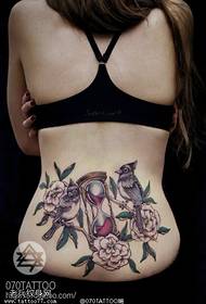 Kvinnlig midja timglas rosfågel tatuering bild