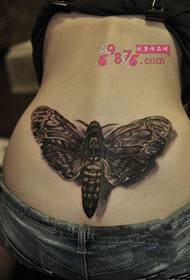 alternativ moth flicka tatueringsbild på bak midjan