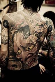 maschera demone di colore posteriore e motivo tatuaggio ciliegia