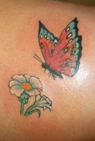 обратно летящ красив модел татуировка на пеперуди и цветя