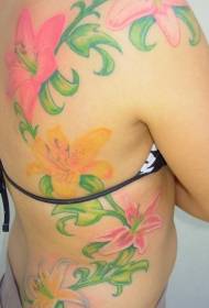 Rygg og side ribbeina i forskjellige farger av lilje tatoveringsmønster