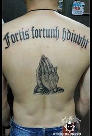 Indietro modello inglese tatuaggio mano pregando