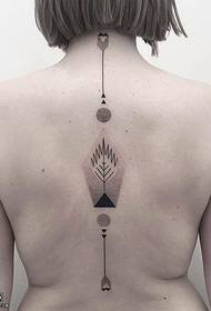 patrón de tatuaje de tótem punteado en la columna vertebral
