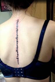 girl's back personality Sanskrit tattoo