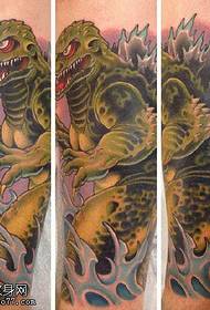 Atgal originalus tatuiruotės modelis su dinozaurais