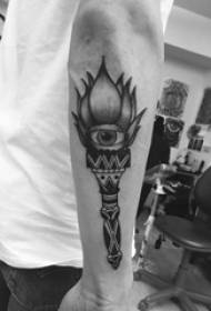 Eye tattoo, boy's arm, torch and eye tattoo picture