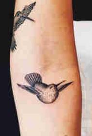 Arm tattoo material girl black bird tattoo picture on arm