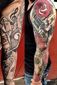 歐美花臂紋身男學生手臂上花和吉他紋身圖片