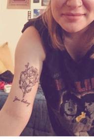 Arm tattoo picture girl arm on english and flower tattoo picture